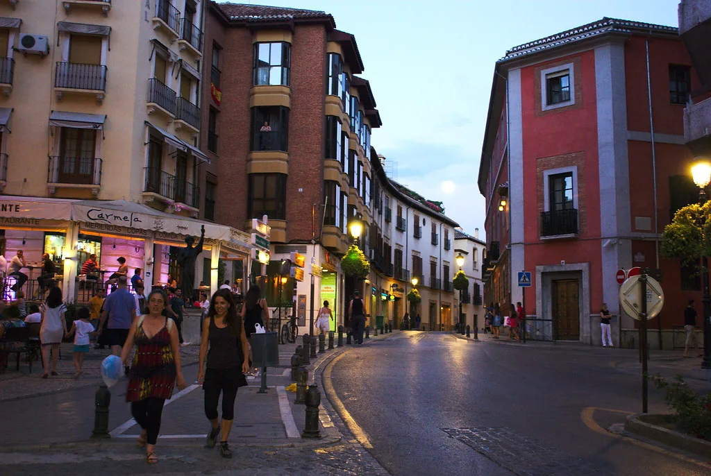 A narrow cobbled street in Granada's Albaicín, the kind of terrain your packing list should account for