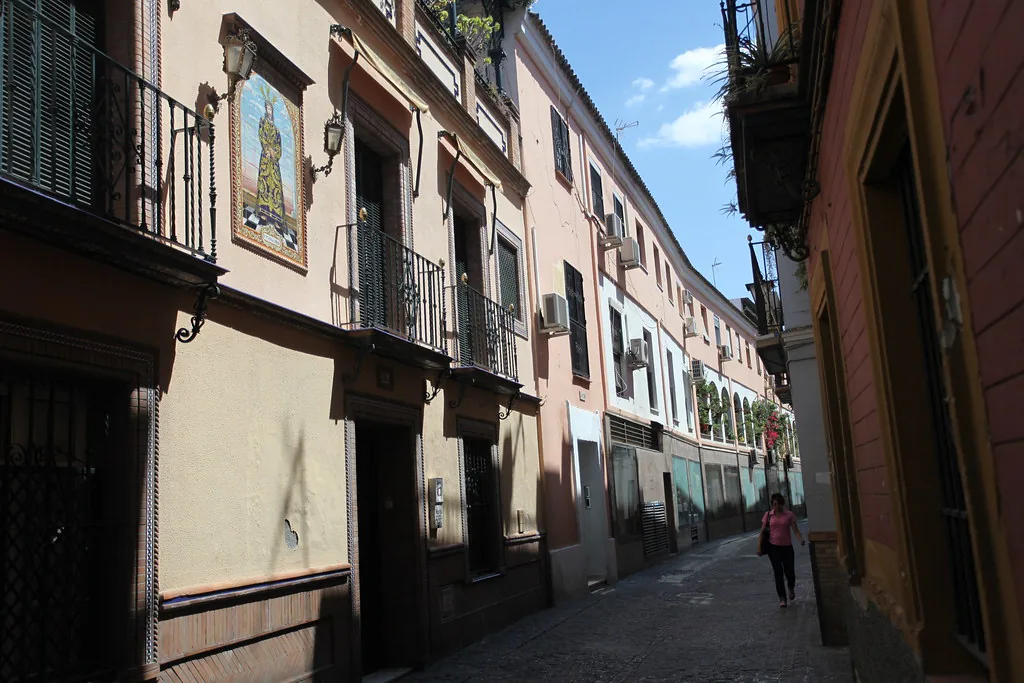 Narrow cobblestone street in central Seville, Spain, where day-bag security and document copies matter most