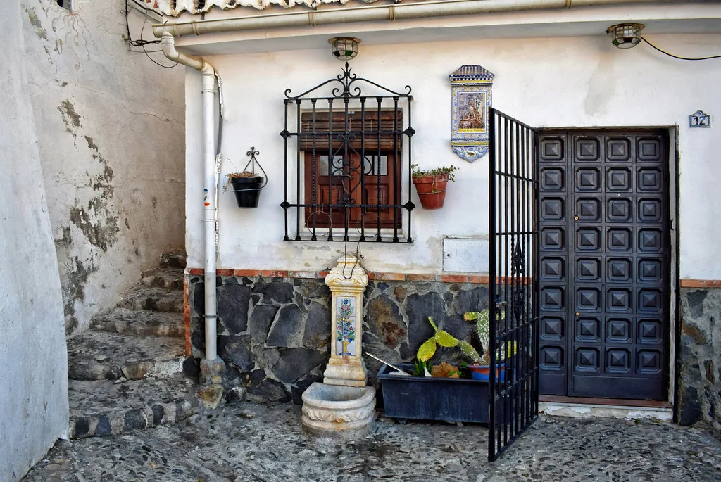 Plaza in Granada, Spain with stone paving that calls for supportive walking shoes in August