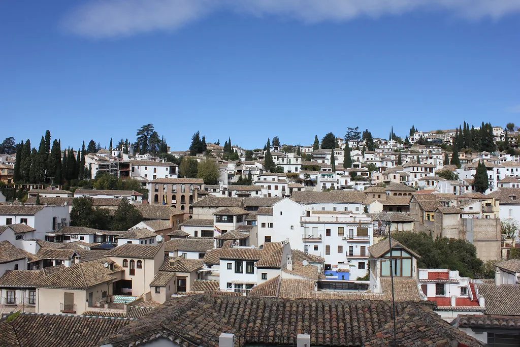 Granada's Plaza Santa Ana, a central square where modest cover-ups keep you city-appropriate in June