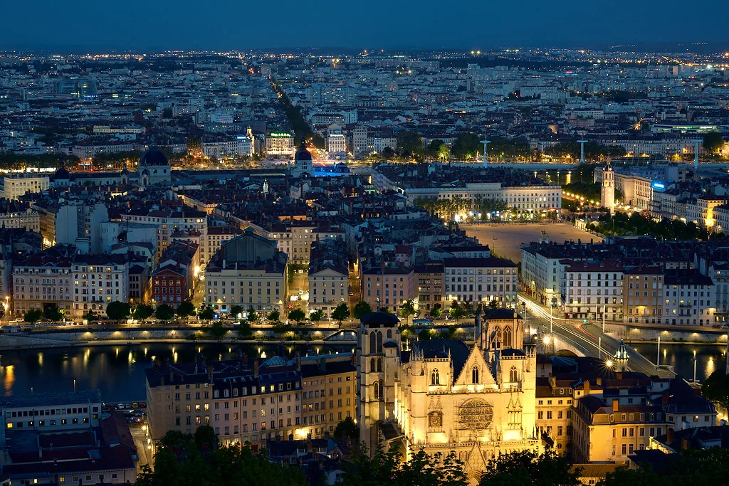 Warm Lyon summer evening light, the moment to swap daywear for crisp linen before a Bouchon dinner