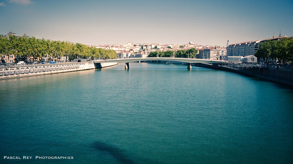 Lyon city skyline at golden hour, perfect for an evening bouchon dinner outfit in July