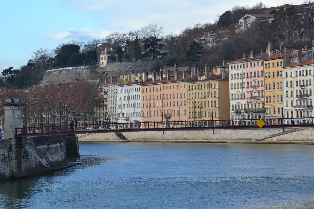Evening view of Lyon, France, where smart-casual coats and scarves suit cool October dinners