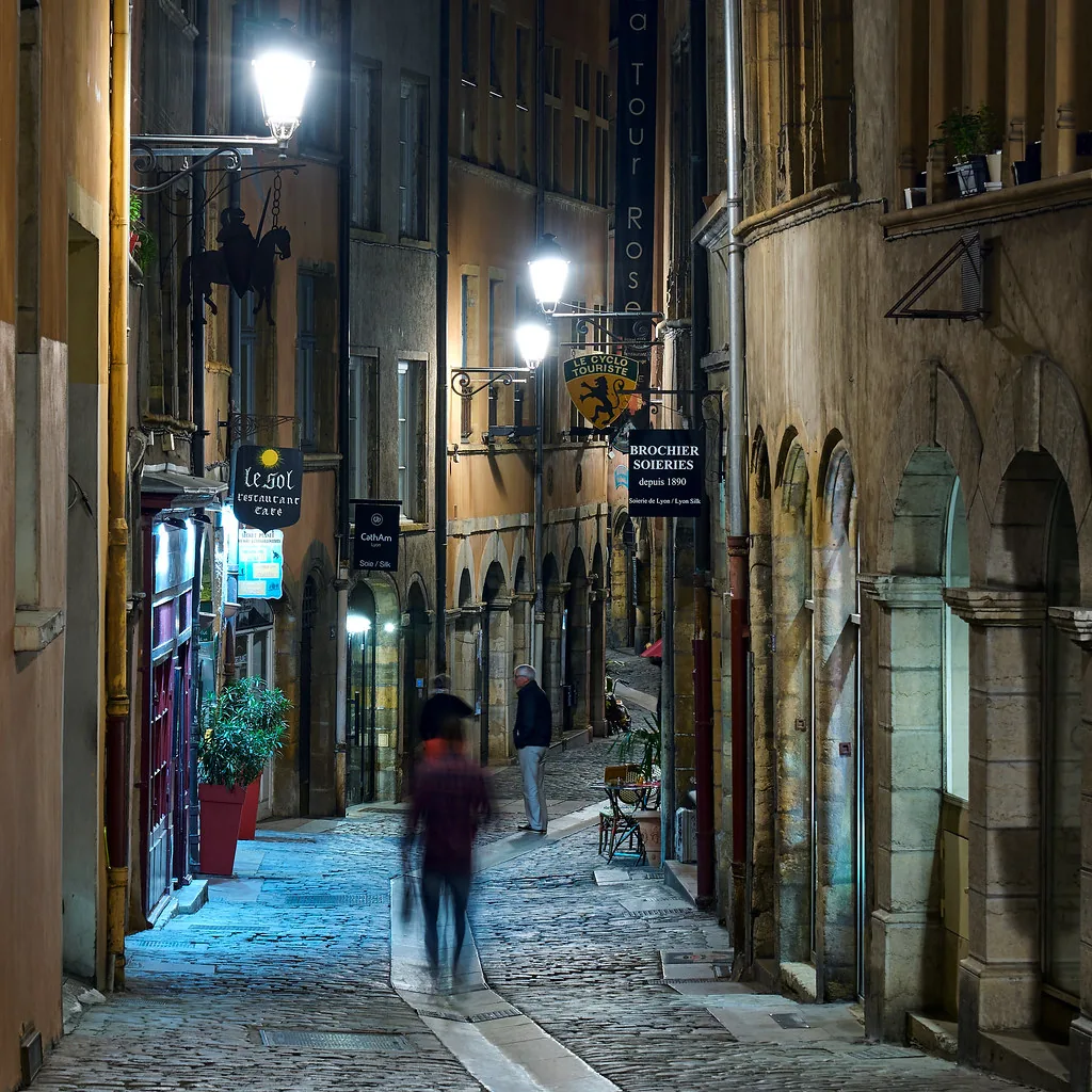 Cobbled Lyon street in early autumn light, ideal for layered September outfits