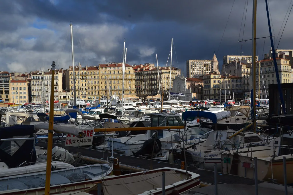 Wide view of Marseille city and coastline in summer, showing the terrain that shapes footwear choices