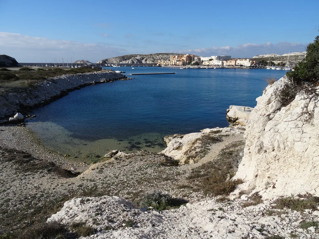 Marseille hillside streets and rooftops, the steep limestone terrain that calls for supportive October footwear