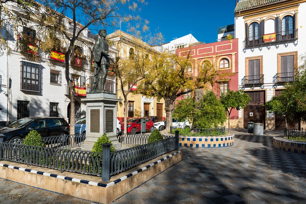 Bright Seville summer scene with warm Andalusian light, ideal for breathable linen outfits