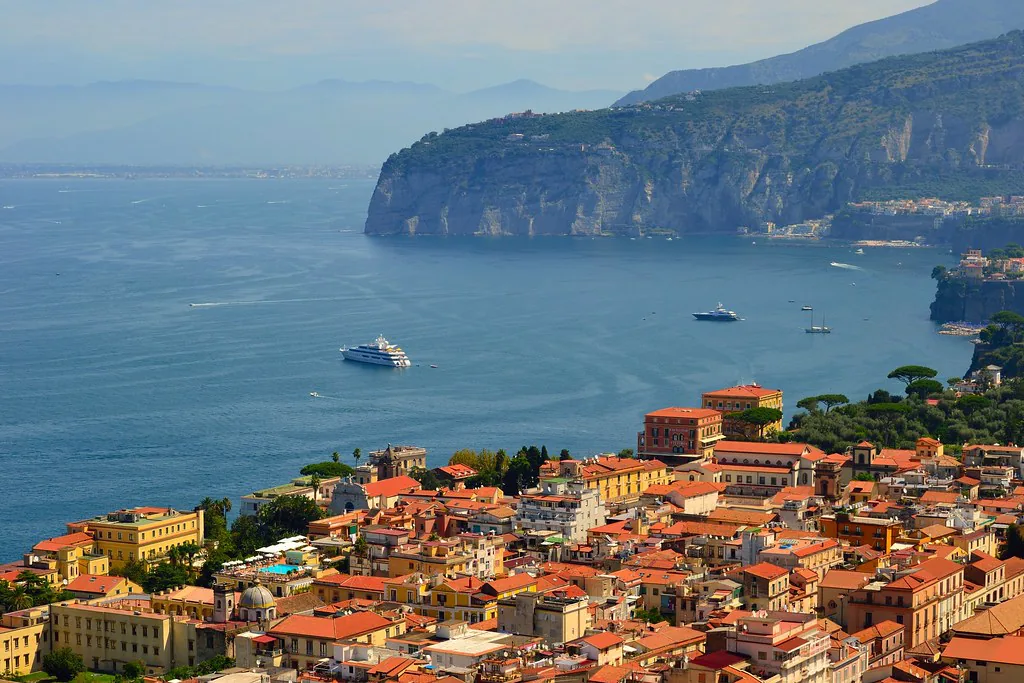 A sunlit street in Sorrento, Italy in spring with pastel buildings