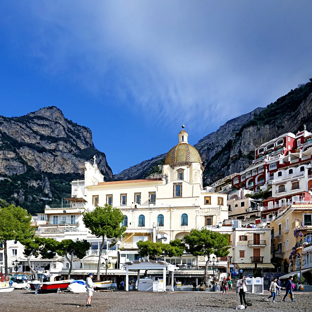 Pastel buildings along a narrow Sorrento street in Campania, Italy, on a bright June day
