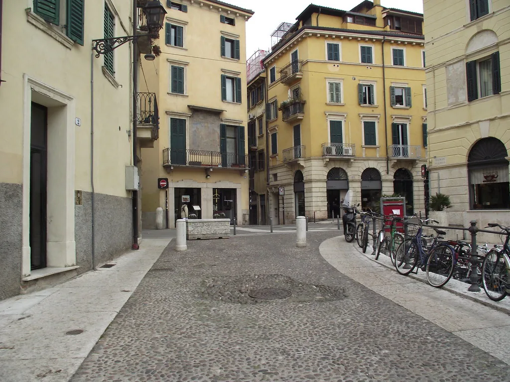 Verona's marble streets and squares under bright summer light in July