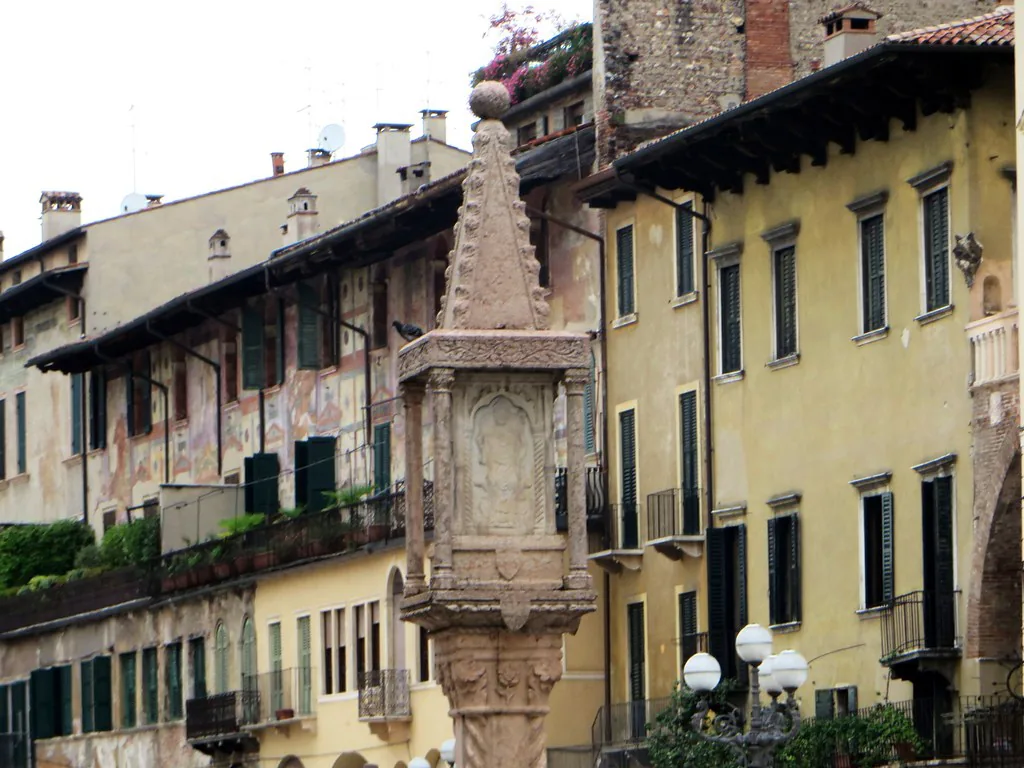 Verona's old town rooftops and pastel buildings under spring skies in May